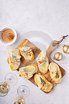 New Years Eve party appetizer, pear and brie crostini