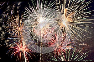 New Year`s Eve and Fourth of July Fireworks in South Florida cover the night sky with bursts of vibrant colors.