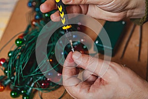 New Years is soon. Repair of Christmas tree electric garland