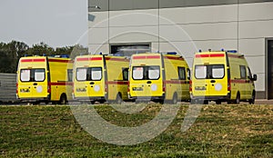 New yellow ambulances in the parking lot