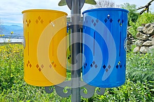 New yellow and blue garbage bins in the city of Milazzo, Italy