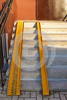 New yellow ramps on the stairs at the entrance to the house, room