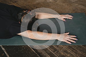 new yoga teacher woman resting in child pose in her vinyasa flow yoga practice