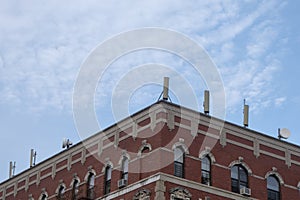 New York building with cellular towers on a their rooftop on a bright sunny day