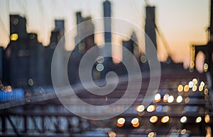 Aerial view over manhattan with brooklyn bridge blurred lights night view skyline, abstract background