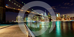 New York City Brooklyn Bridge and Manhattan skyline Hudson River illuminated