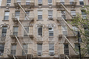 New York City building facades with fire escape stairs