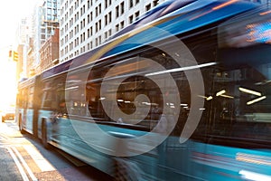 New York City bus driving down the street through Manhattan with motion blur effect