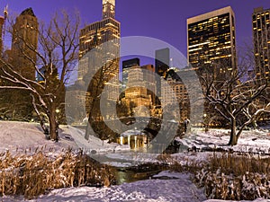 New York City Central Park in snow winter evening