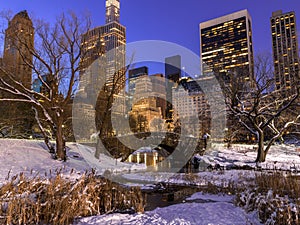 New York City Central Park in snow winter evening