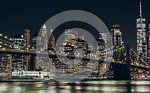 New York City empty streets. New York City skyline at night with Brooklyn Bridge.