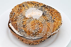 New York City Everything Bagel Filled with Lox Spread Cream Cheese on a White Plate