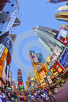 people enjoy the evening at  at Times Square  in New York City