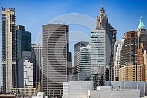 New York City lower Manhattan skyline view with skyscrapers and blue sky in the day.