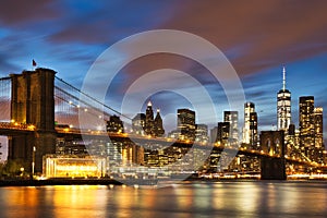 New York City Manhattan Downtown with Brooklyn Bridge at Dusk