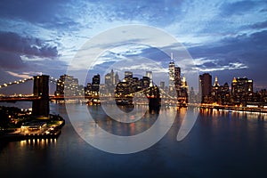 New York City Manhattan Downtown with Brooklyn Bridge at dusk