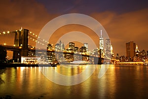 New York City Manhattan Downtown with Brooklyn Bridge at dusk