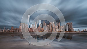 New York City Manhattan downtown skyline in evening with stormy sky