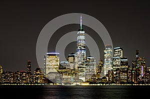 New York City Manhattan skyline panorama at night over Hudson river with reflections viewed from New Jersey