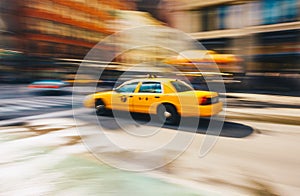 New York City - March 20, 2017 : Yellow taxi cab speeds down in a New York City Street. Shot with long shutter speed for