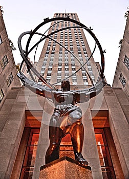 NEW YORK CITY - May 20, 2016: Atlas statue by Lee Lawrie in front of Rockefeller Center with art deco building in background in mi