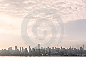 New York City midtown Manhattan skyline panorama view from Boulevard East Old Glory Park over Hudson River.