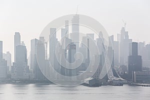 New York City midtown Manhattan skyline panorama view from Boulevard East Old Glory Park over Hudson River.