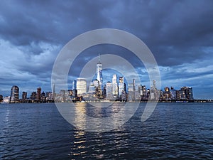 new york city at night. skyscraper building of nyc. ny urban city architecture. midtown manhattan and hudson river