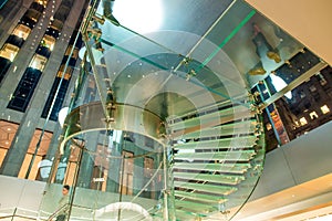 NEW YORK CITY - OCTOBER 2015: Modern glass stairs inside the famous Fifth Avenue Apple Store flagship