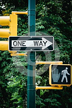 New York City road sign One Way with traffic pedestrian light on the street in Manhattan. Urban city lifestyle photo.