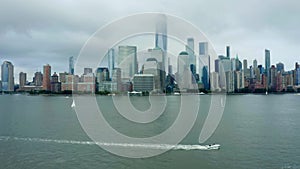New York City skyline Cloudy Day. Epic cinematic aerial view from Hudson River