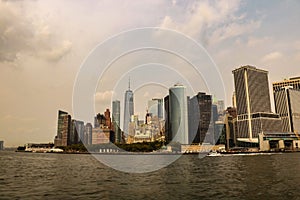 New york city skyline daytime sun clouds blue golden hour