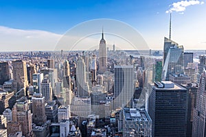 New York City Skyline in Manhattan downtown with Empire State Building and skyscrapers on sunny day with clear blue sky USA