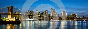 New York City skyline of Manhattan panorama with Brooklyn Bridge and World Trade Center skyscraper at twilight in the United