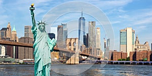 New York City skyline of Manhattan with Statue of Liberty, Brooklyn Bridge and World Trade Center photomontage panorama in the