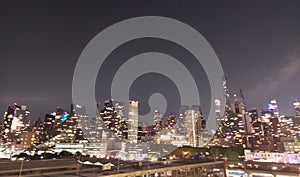 New York City Skyline at Night with Illuminated Skyscrapers