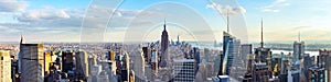 New York City skyline from roof top with urban skyscrapers before sunset.