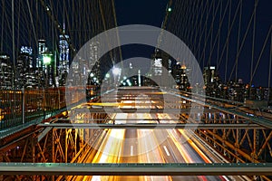 New York City skyline, traffic at the Brooklyn Bridge at night, Manhattan buildings and skyscrapers