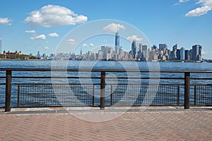 New York city skyline view and Ellis Island from dock terrace