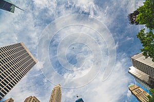 New York City skyscrapers and beautiful cloudy sky background.