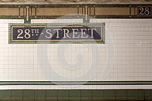 New York City Station subway 28th Street sign on tile wall.