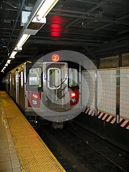 New York City Subway Train Entering Station photo