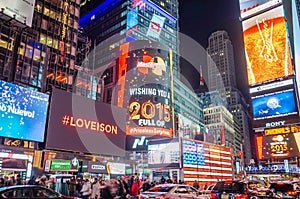 New York City Times Square at Night, Full of Big LED Screens and Bright Lights. Screens Carry Advertisements and Messages