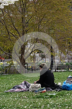 New York City empty streets, homeless man sitting in the park