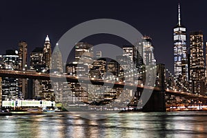 New York City empty streets. NYC skyline with Brooklyn bridge at night