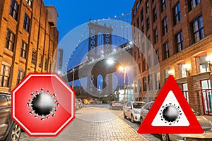 New York City, USA. Concept image with large red coronavirus warning sign in front of Brooklyn night skyline and Manhattan Bridge