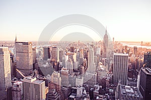 New York City - USA. View to Lower Manhattan downtown skyline with famous Empire State Building and skyscrapers at sunset