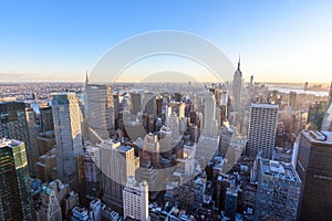 New York City - USA. View to Lower Manhattan downtown skyline with famous Empire State Building and skyscrapers at sunset