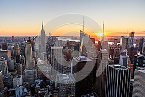 New York City - USA. View to Lower Manhattan downtown skyline with famous Empire State Building and skyscrapers at sunset