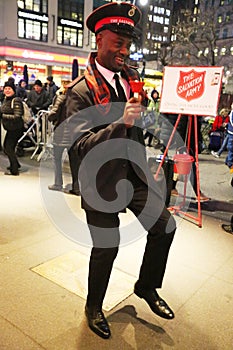 Salvation Army soldier performs for collections in midtown Manhattan.